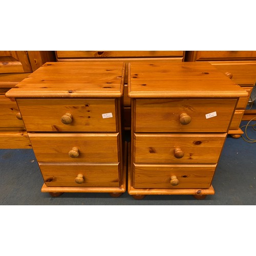 8 - DARKER PINE PAIR OF THREE DRAWER BEDSIDE CHESTS