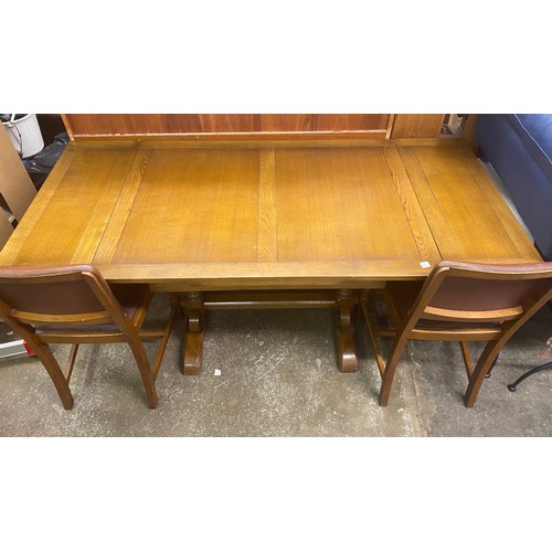 57 - OAK DRAWER LEAF DINING TABLE AND FOIUR REXINE COVERED CHAIRS