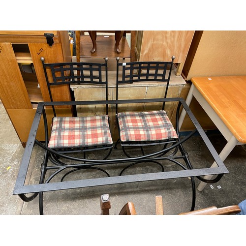 55 - BLACKENED WROUGHT IRON TABLE BASE AND TWO CHAIRS