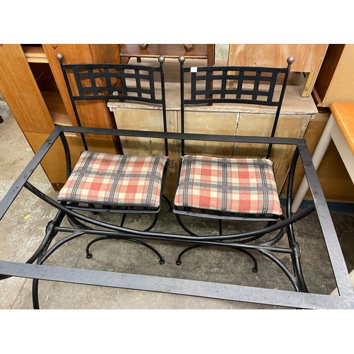 55 - BLACKENED WROUGHT IRON TABLE BASE AND TWO CHAIRS