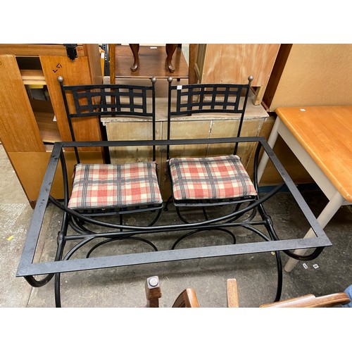 55 - BLACKENED WROUGHT IRON TABLE BASE AND TWO CHAIRS