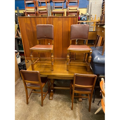 57 - OAK DRAWER LEAF DINING TABLE AND FOIUR REXINE COVERED CHAIRS