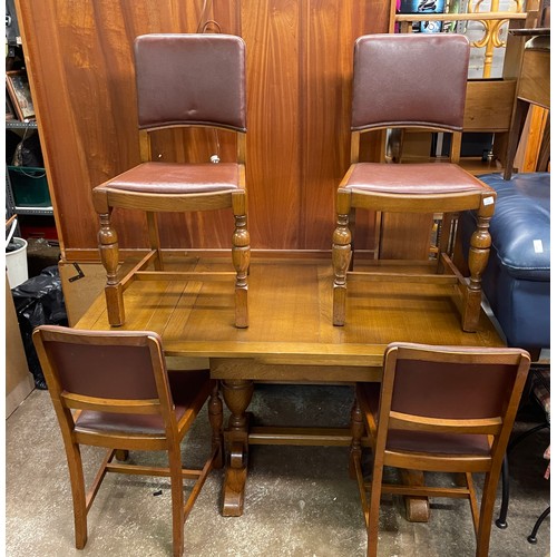 57 - OAK DRAWER LEAF DINING TABLE AND FOIUR REXINE COVERED CHAIRS