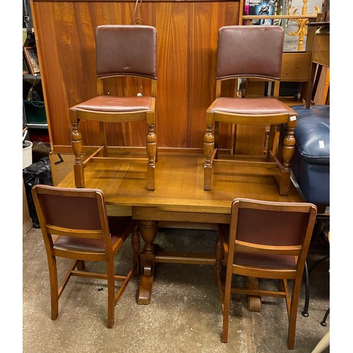 57 - OAK DRAWER LEAF DINING TABLE AND FOIUR REXINE COVERED CHAIRS