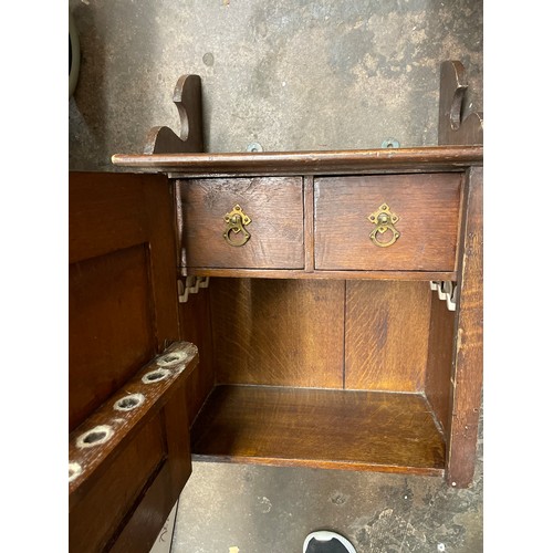 148 - OAK CARVED PANEL DOOR SMOKERS CABINET