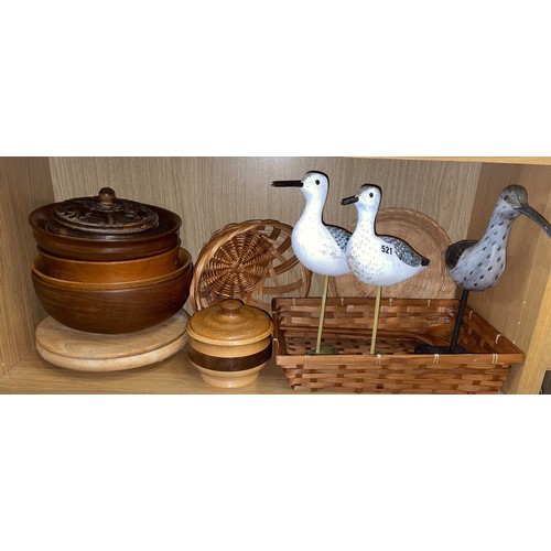 521 - SHELF OF TREEN BOWLS, WICKER BASKETS, AND DECORATIVE WOODEN WADING BIRDS