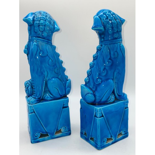 560 - PAIR OF CHINESE BLUE GLAZED POTTERY DOGS OF FO