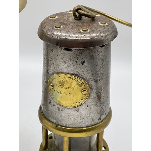 548 - MANX LEGGED BRASS TRIPOD TRIVET AND MINIATURE MINERS SAFETY LAMP