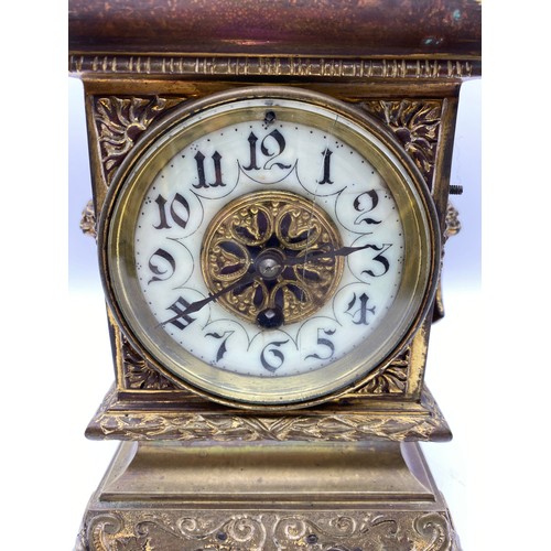 595 - 19TH CENTURY GILT METAL CASED MANTLE CLOCK WITH LIONS MASK HANDLES, DRUM MOVEMENT GLASS A/F