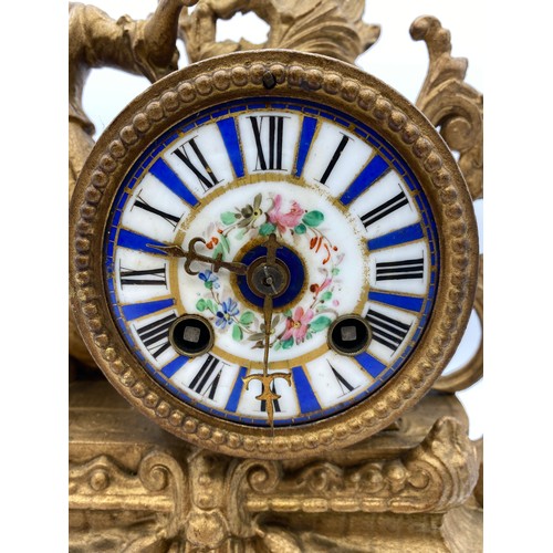 596 - 19TH CENTURY FRENCH GILT SPELTER FIGURAL MANTLE CLOCK WITH BLUE AND WHITE ENAMEL DRUM DIAL AND PORCE... 