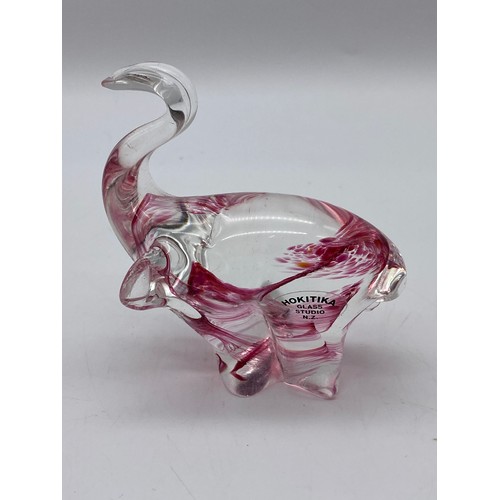 460 - BACARATT CLEAR GLASS DOLPHIN PAPERWEIGHT, HOKITIKA STUDIO GLASS ELEPHANT AND A BLUE GLASS JUG WITH A... 