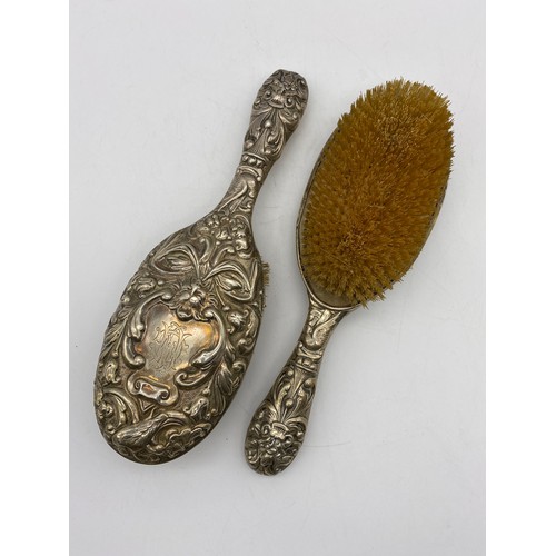 658 - PAIR OF VICTORIAN LONDON SILVER REPOUSSE BACKED BRUSHES