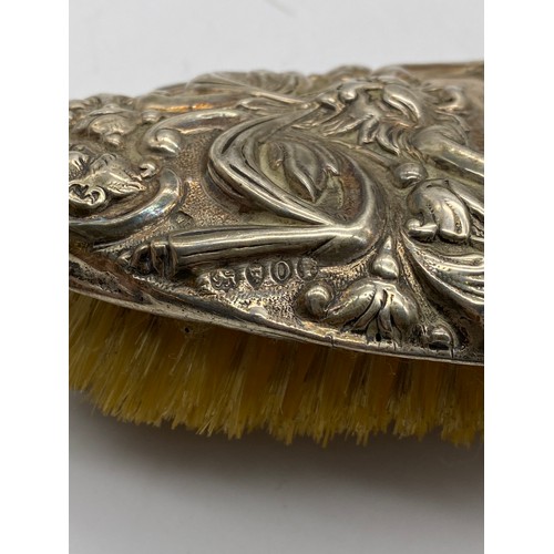 658 - PAIR OF VICTORIAN LONDON SILVER REPOUSSE BACKED BRUSHES