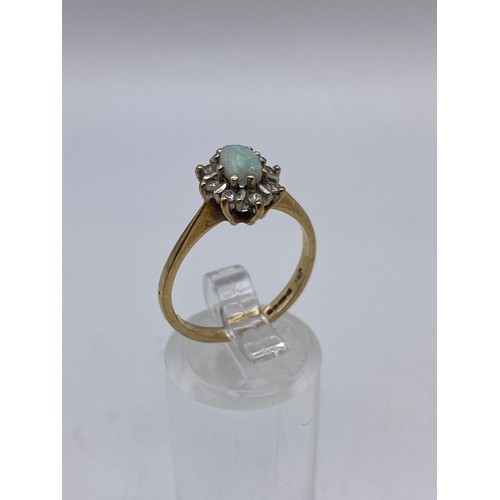 669 - 9CT OPAL AND DIAMOND CHIP CLUSTER RING SIZE O/P 2.6G APPROX