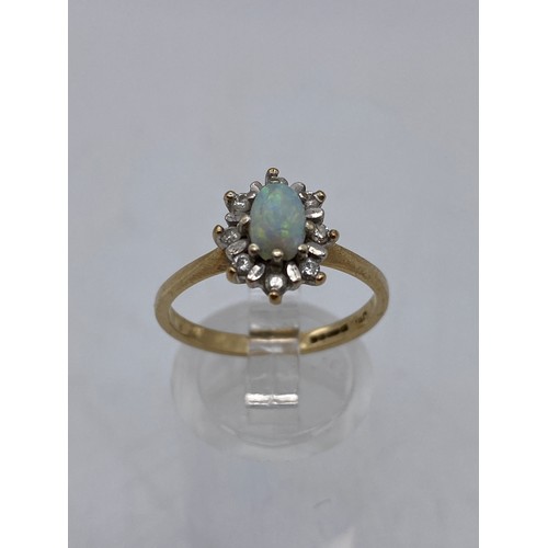 669 - 9CT OPAL AND DIAMOND CHIP CLUSTER RING SIZE O/P 2.6G APPROX