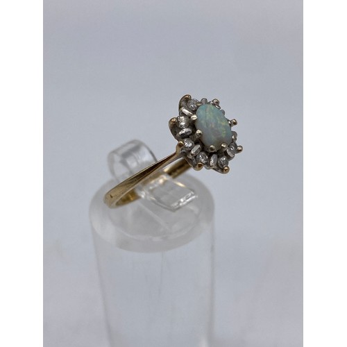 669 - 9CT OPAL AND DIAMOND CHIP CLUSTER RING SIZE O/P 2.6G APPROX