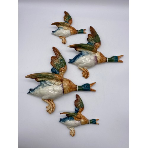 569 - BESWICK 5961, 2, AND 4 GLOSS FLYING GEESE WALL PLAQUES