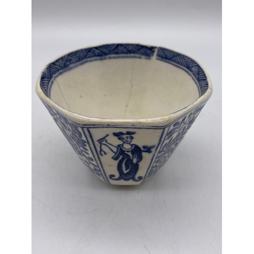 687 - 18TH CENTURY CHINESE DECORATED OCTAGONAL TEA BOWL AND SAUCER A/F