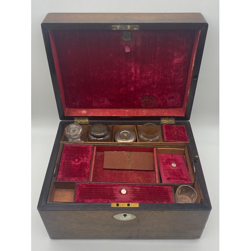 704 - 19TH CENTURY MAHOGANY TRAVELLING VANITY BOX WITH BOTTLES AND COMPARTMENTS