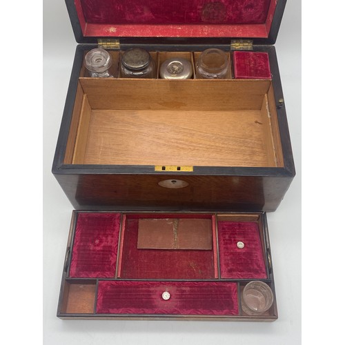 704 - 19TH CENTURY MAHOGANY TRAVELLING VANITY BOX WITH BOTTLES AND COMPARTMENTS