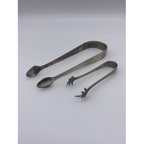 654 - PAIR OF GEORGIAN SILVER SUGAR TONGS WITH BRIGHT CUT DECORATION 1.1 OZ APPROX AND ONE OTHER