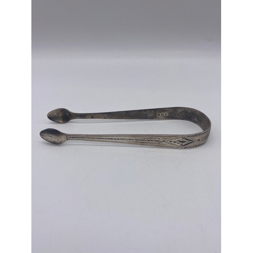 654 - PAIR OF GEORGIAN SILVER SUGAR TONGS WITH BRIGHT CUT DECORATION 1.1 OZ APPROX AND ONE OTHER