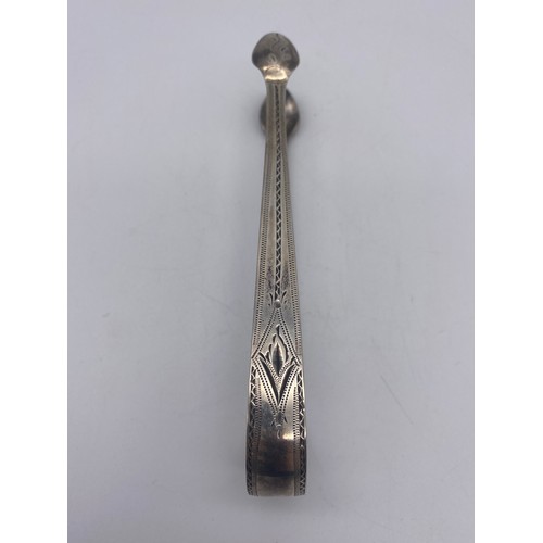 654 - PAIR OF GEORGIAN SILVER SUGAR TONGS WITH BRIGHT CUT DECORATION 1.1 OZ APPROX AND ONE OTHER