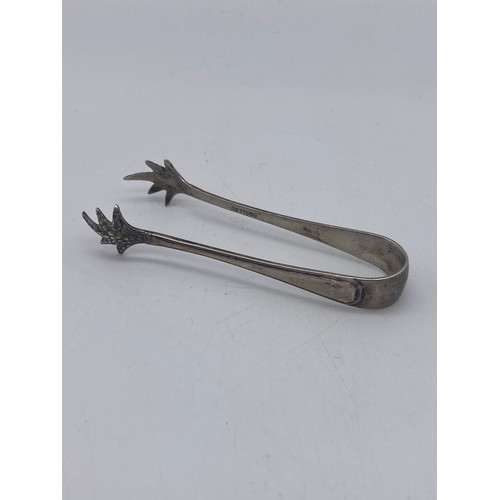 654 - PAIR OF GEORGIAN SILVER SUGAR TONGS WITH BRIGHT CUT DECORATION 1.1 OZ APPROX AND ONE OTHER