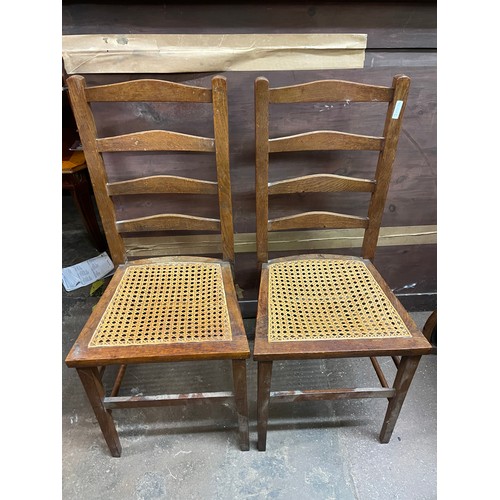 30 - PAIR OF EARLY 20TH CENTURY OAK BREGERE CANED LADDER BACK BEDROOM CHAIRS