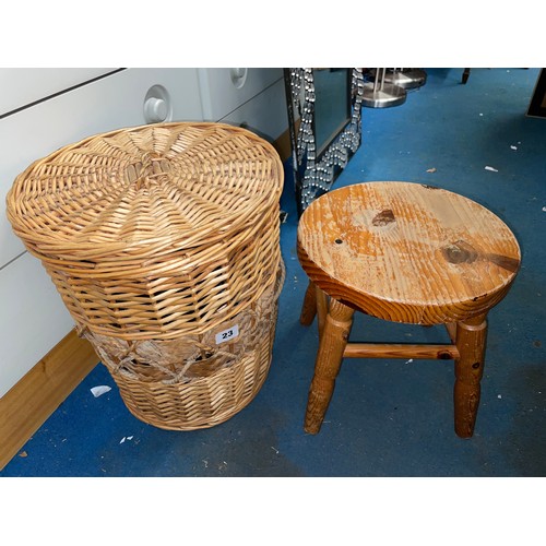 23 - PINE MILKING STOOL AND A WICKER BIN