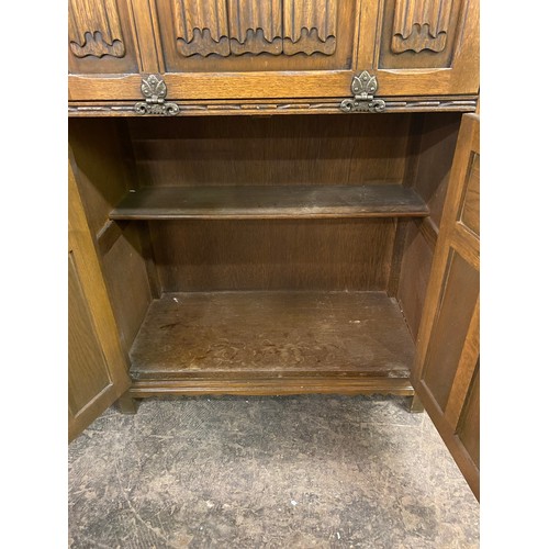 99 - OAK LINENFOLD DRINKS CABINET