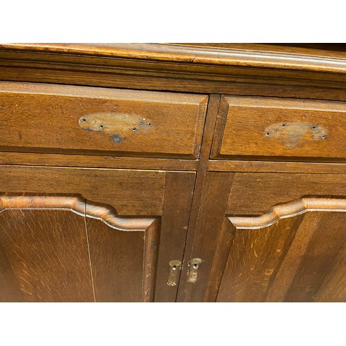 137 - OAK DRESSER BASE WITH FIELDED PANEL DOORS