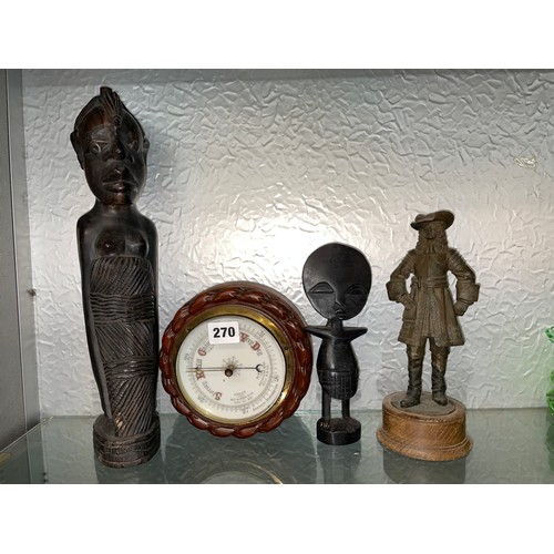 270 - SMALL ANEROID ROUNDEL BAROMETER, CARVED AFRICAN HARDWOOD FIGURES, AND A RESIN FIGURE OF A CAVALIER