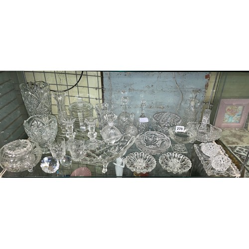 278 - SHELF OF GLASSWARES INCLUDING ROSE BOWL, DECORATIVE BELLS, CANDLE STICKS