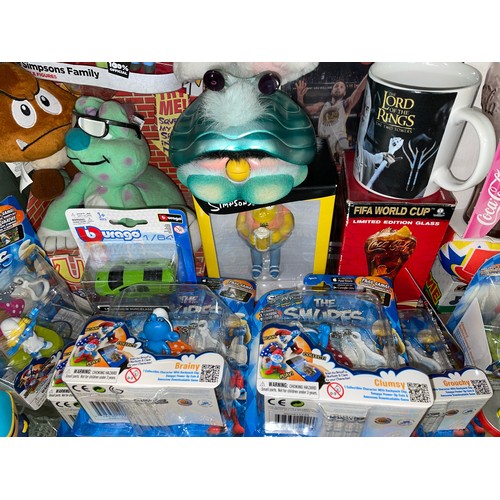 280 - SHELF OF TOYS AND COLLECTABLES INCLUDING THE SIMPSONS, FURBYS, SESAME ST, SMURFS, AND SOME SPORTING