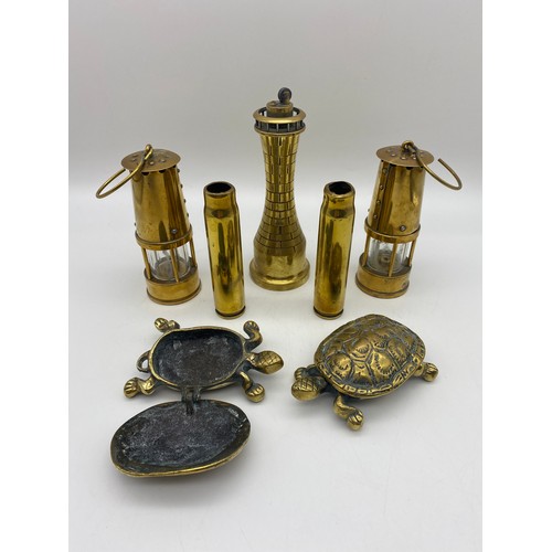 481 - TRENCH ART NOVELTY LIGHT HOUSE LIGHTER, BRASS MINIATURE DAVEY LAMPS AND TWO TORTOISE BOXES