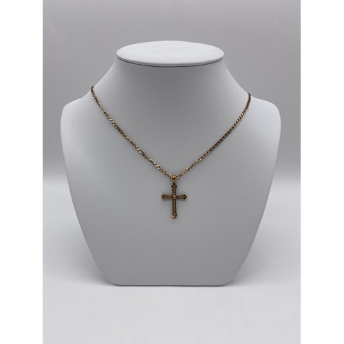 513 - 9CT GOLD AND DIAMOND CROSS ON A FLAT CURB LINK CHAIN 4.9G APPROX