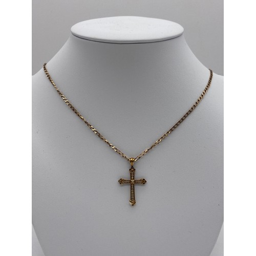 513 - 9CT GOLD AND DIAMOND CROSS ON A FLAT CURB LINK CHAIN 4.9G APPROX