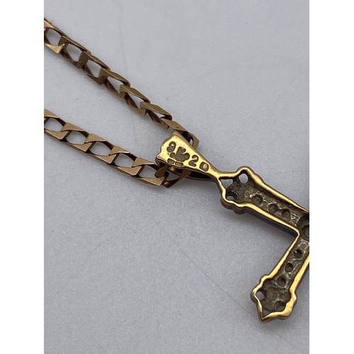 513 - 9CT GOLD AND DIAMOND CROSS ON A FLAT CURB LINK CHAIN 4.9G APPROX