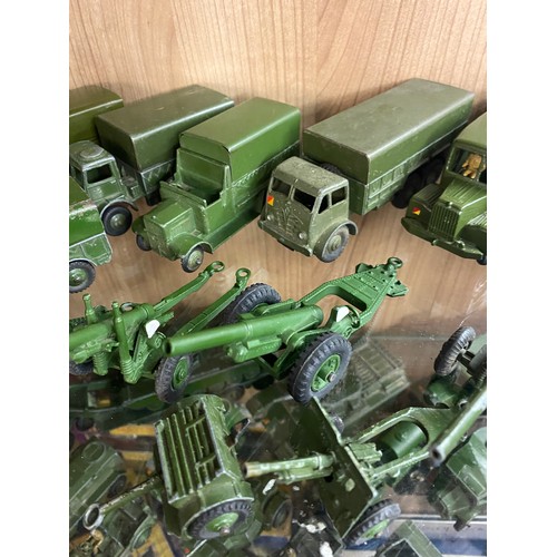 365 - TWO SHELVES OF MAINLY DINKY DIE CAST MILITARY VEHICLES, FIELD GUNS, AMBULANCE, ETC