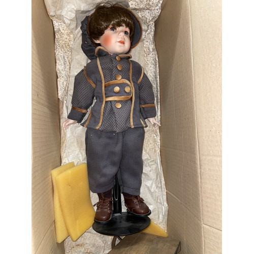 534 - BOXED HEIRLOOM PORCELAIN HEADED COCACOLA BOY HEADED DOLL