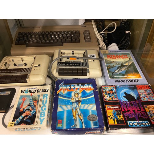 392 - COMMODORE 64 GAME CONSOLE, TWO CASSETTE RECORDERS AND SELECTION OF GAMES