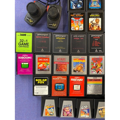 503 - BOXED ATARI 2600 VIDEO COMPUTOR SYSTEM WITH PADDLES, JOYSTICK, AND VARIOUS GAMES, AND ONE UNBOXED AT... 