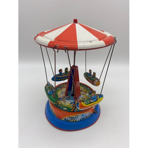 263 - BOXED GERMAN MADE TIN PLATE MECHANICAL CAROUSEL