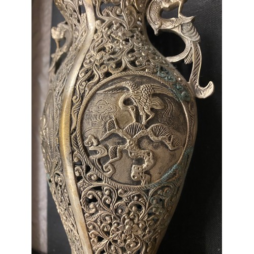 527 - CHINESE METAL WORK COMPRESSED BALUSTER VASE WITH DRAGON HANDLES IN A GLAZED CASE