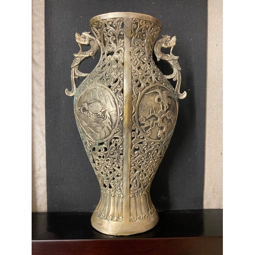 527 - CHINESE METAL WORK COMPRESSED BALUSTER VASE WITH DRAGON HANDLES IN A GLAZED CASE