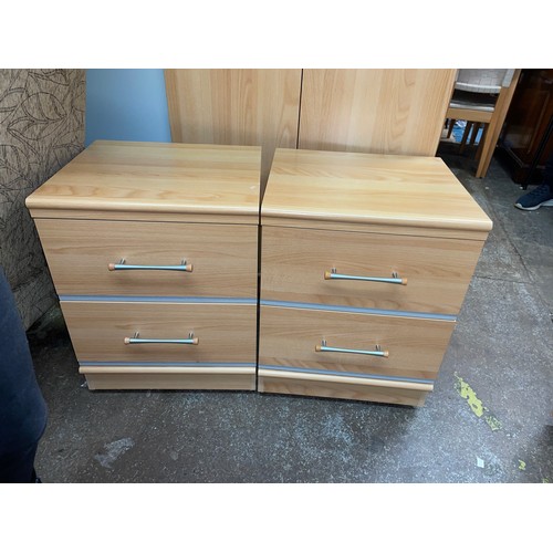 65 - TEAK EFFECT TWO DRAWER BEDSIDE CHESTS