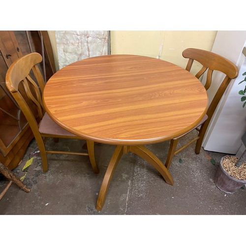 137 - TEAK CIRCULAR PEDESTAL BREAKFAST TABLE AND PAIR OF DINING CHAIRS