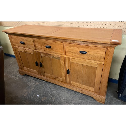 132 - OAK THREE CUPBOARD SIDEBOARD