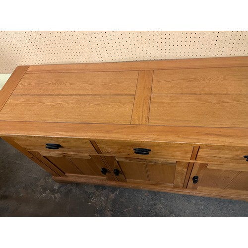 132 - OAK THREE CUPBOARD SIDEBOARD